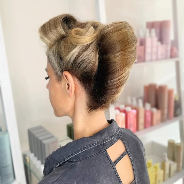 Blonde hair arranged in a sculptural updo