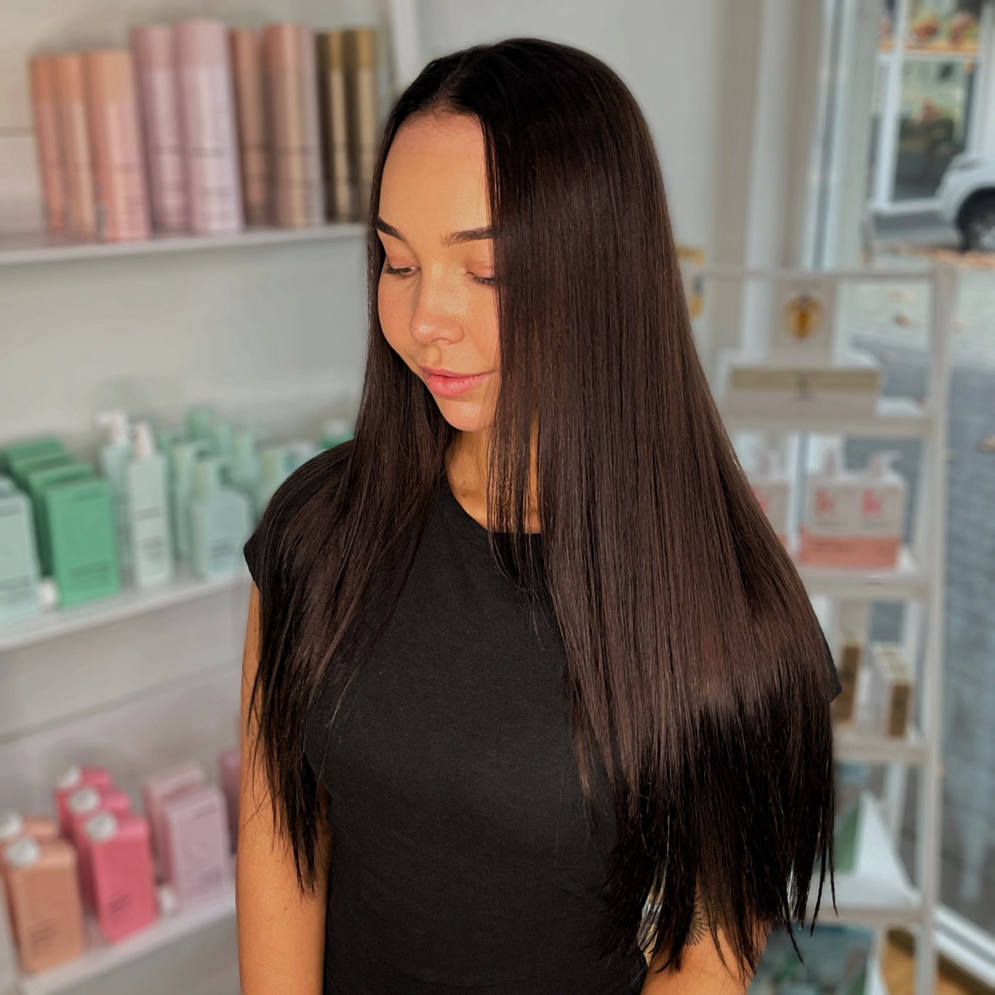 Long, glossy brunette hair with a smooth finish